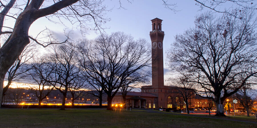 CCF_Headers_900x450_AboutUs Waterbury clock tower at dusk. Photo by Dorian Mode Photography