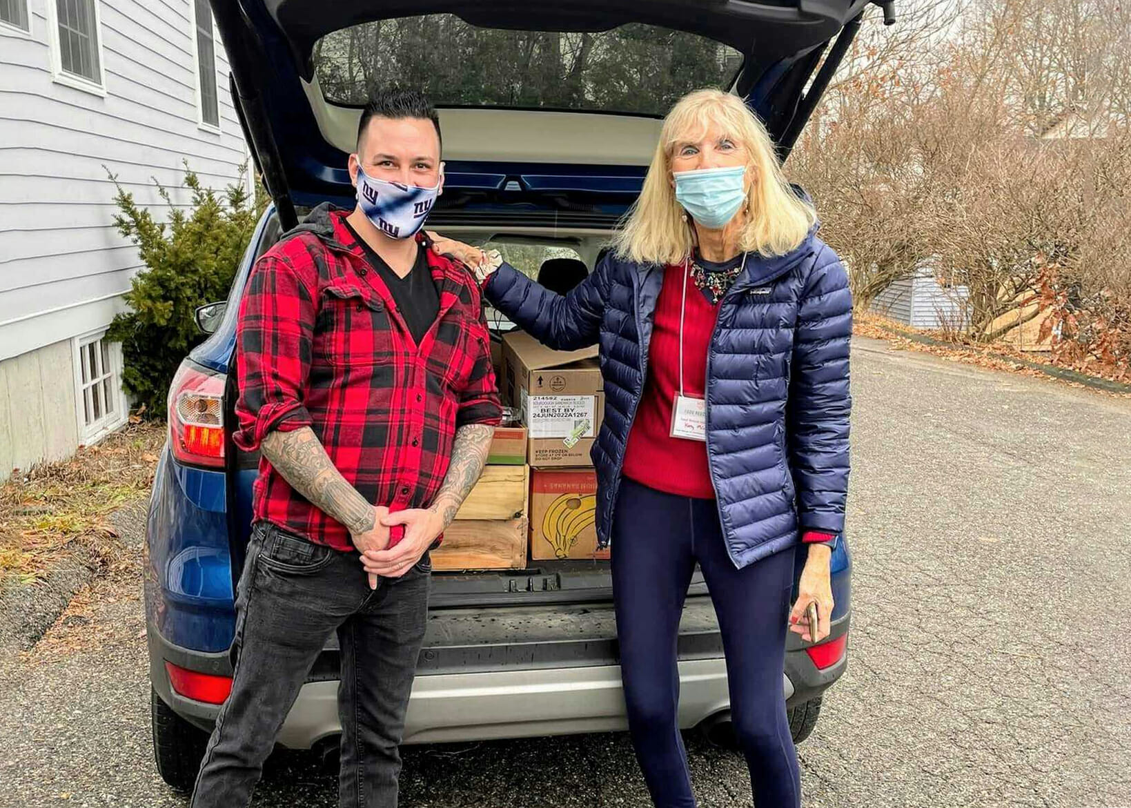 Zak Richie, Prime Time House clubhouse manager, and Kathy Minck, site director of Food Rescue US – NWCT, deliver fresh produce from The Market CT in Bantam.